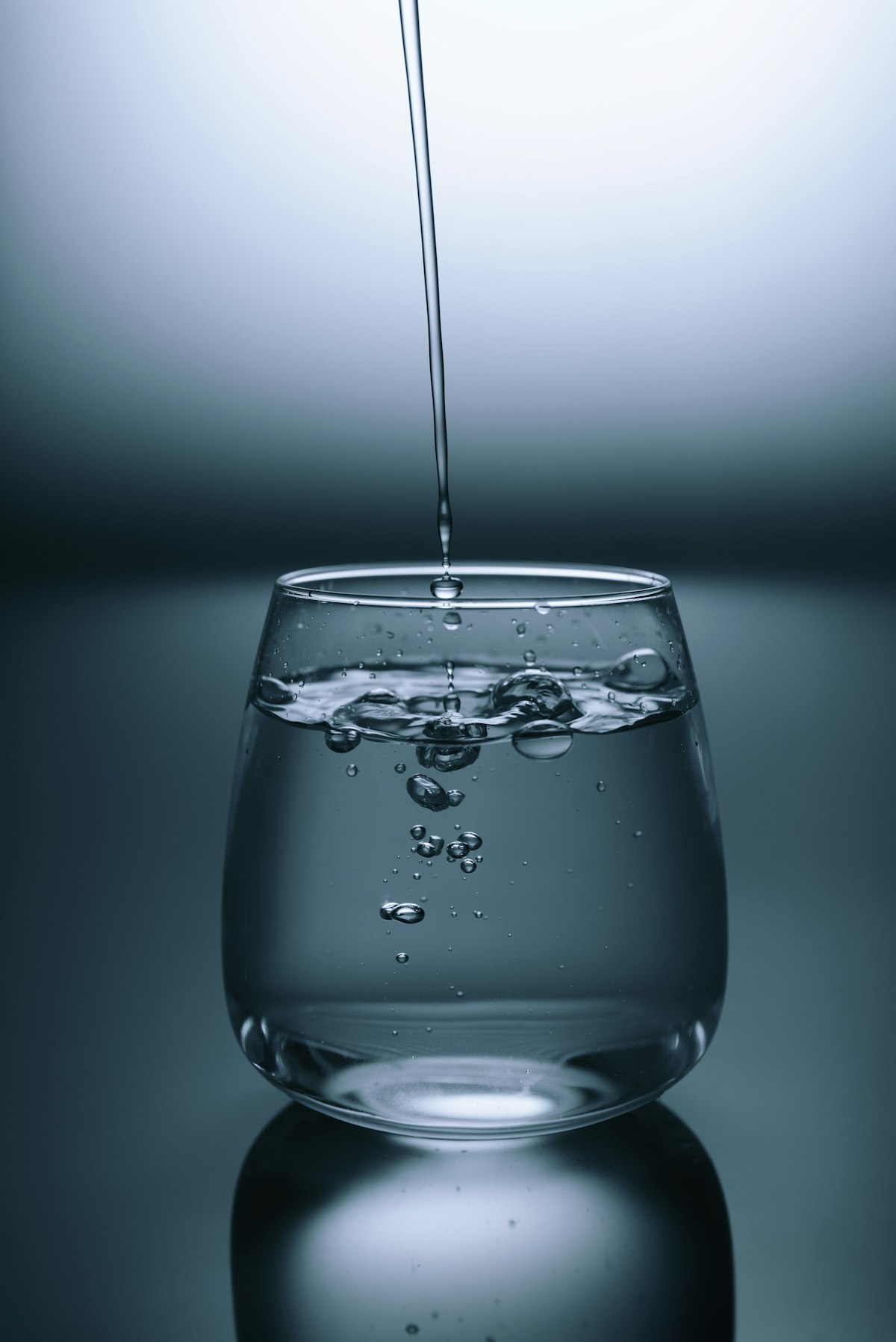 Glass of water with citrus — hydration as daily foundation